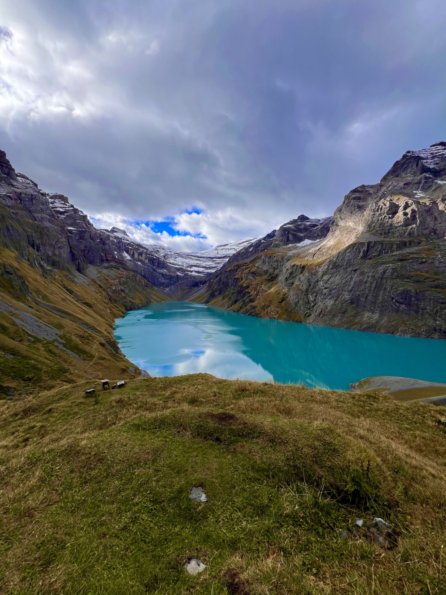 Swiss alpine lake surrounded by mountains