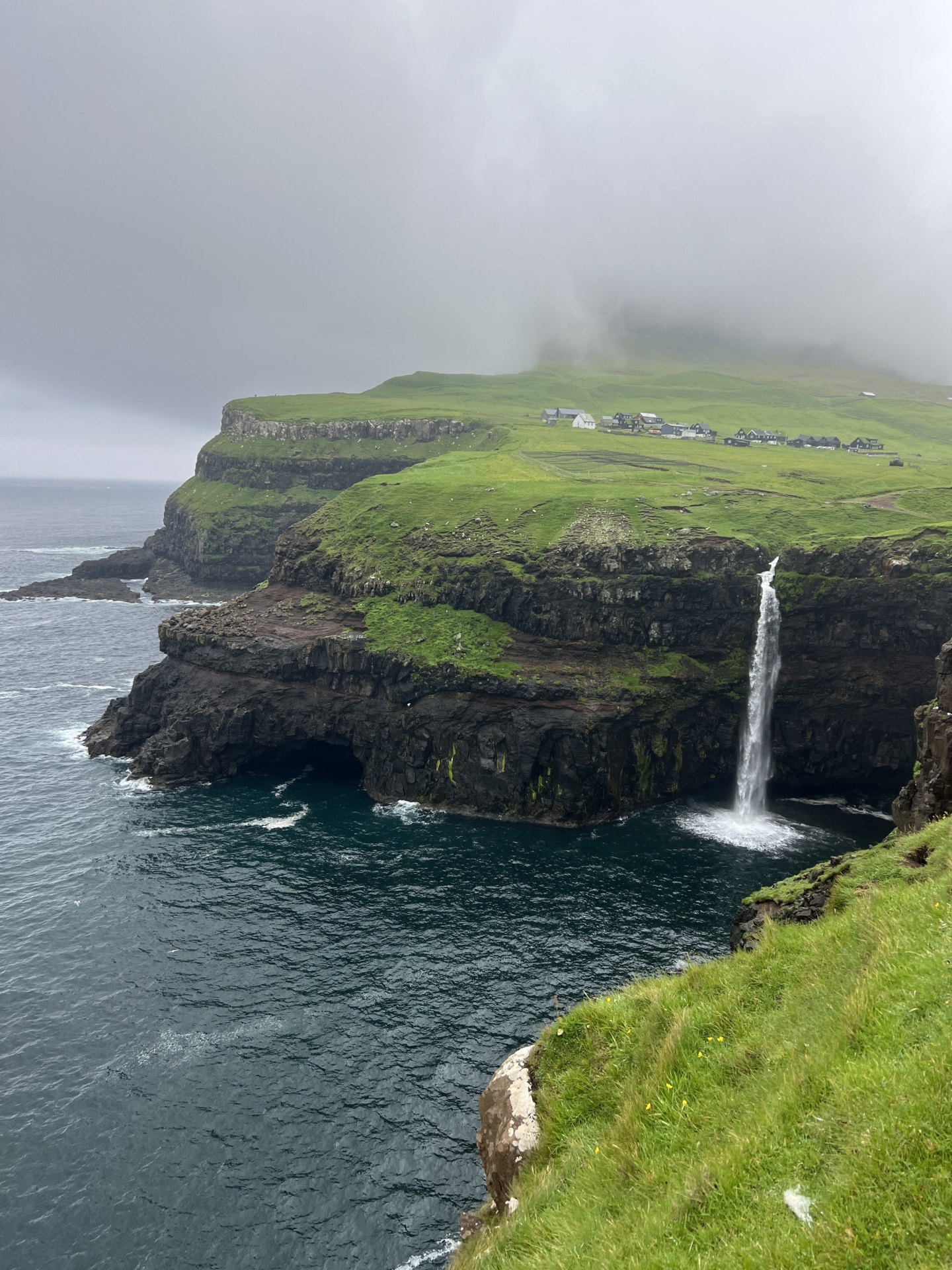 Múlafossur waterfall and Gásadalur village in Faroe Islands